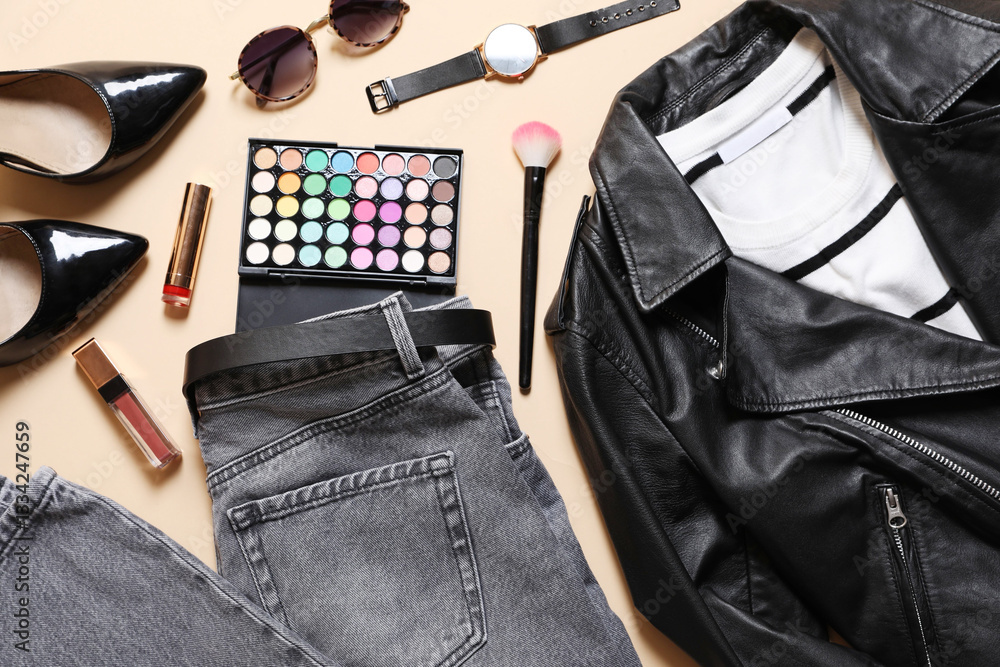 Fototapeta premium Stylish women's outfit. Clothes, accessories and makeup products on beige background, flat lay