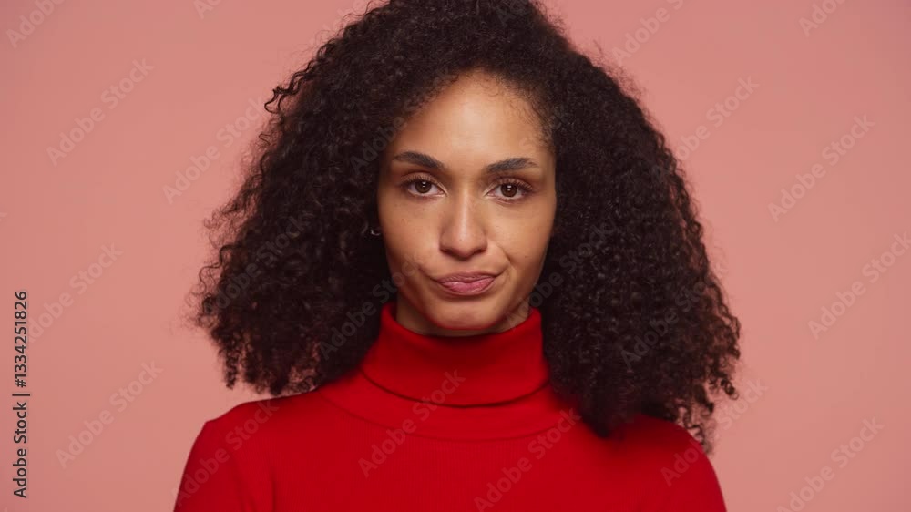 Woman shaking head in disapproval with unimpressed expression on pink Woman shaking head in disapproval with unimpressed expression on pink
