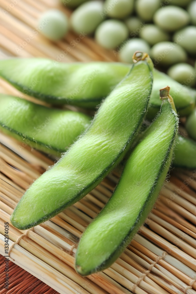 Fresh Green Edamame Pods on Bamboo Mat Close Up Fresh Green Edamame Pods on Bamboo Mat Close Up
