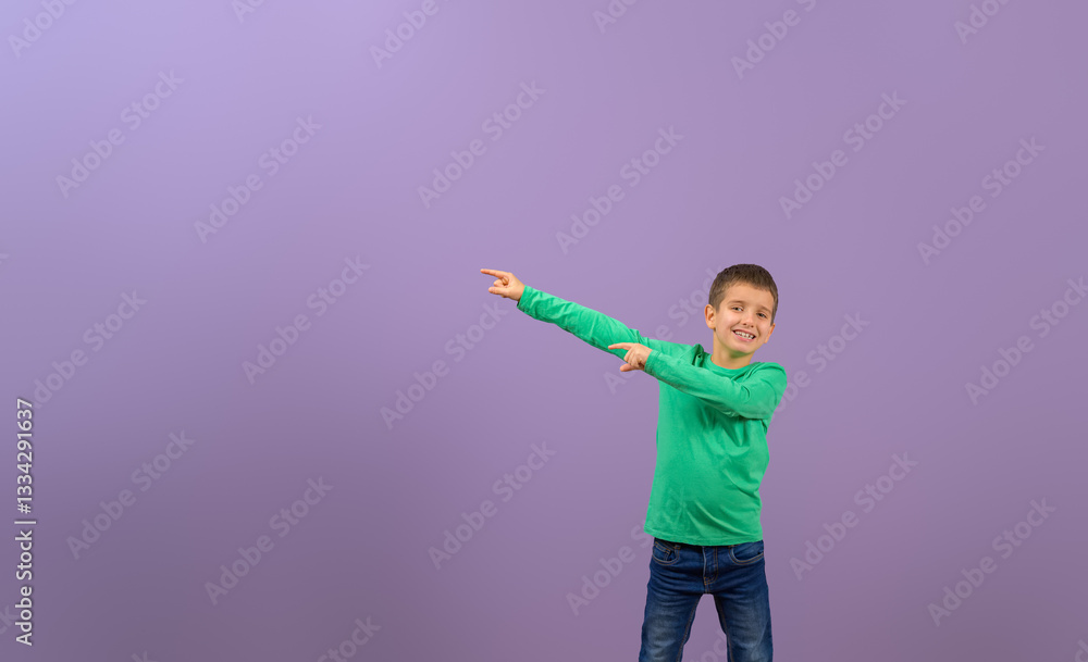 Portrait of young businessman pointing at empty space and marketing new product on purple background Portrait of young businessman pointing at empty space and marketing new product on purple background
