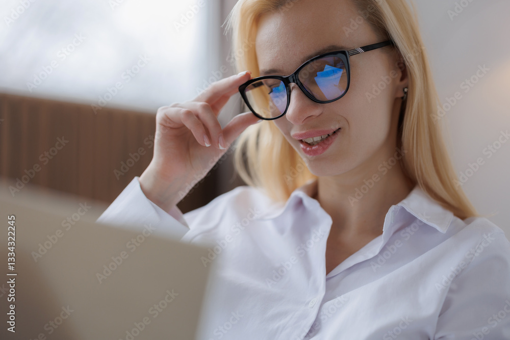 Smiling Woman Working on Laptop with Glasses Smiling Woman Working on Laptop with Glasses