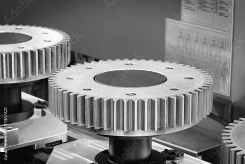 Obraz na plátně gears are shown in close up, one of which is missing a tooth