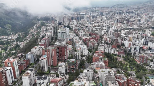 Aerial footage of the city Quito in Ecuador with the Volcan mountain on background