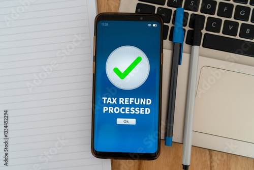 Tax refund approval notification on smartphone app. Concept of taxation benefits and saving money on taxes.