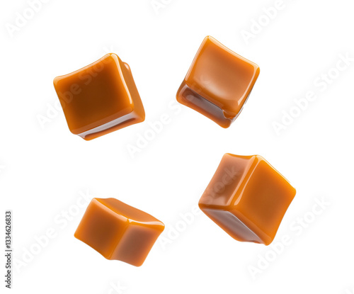 Caramel cubes flying in air isolated on white background. Set of delicious caramel candies floating isolated on white background. caramel cubes. 