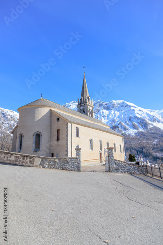 Church of Saint-Laurent in Orcières , France, with Snow-Capped Mountains