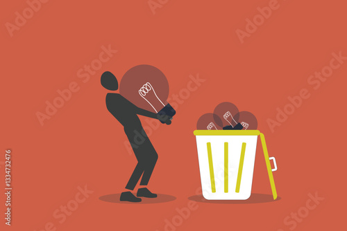 Businessman throw away lightbulb idea into full of junk idea in basket bin. concept of Wasted unworkable ideas, business failure or too many abandoned projects