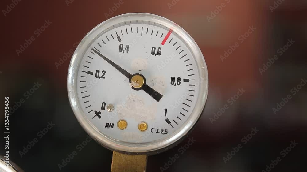 production room. focus on gas cylinder. filled with carbon dioxide. installation of reducer to reduce pressure in cylinder. 50p, close-up. production room. focus on gas cylinder. filled with carbon dioxide. installation of reducer to reduce pressure in cylinder. 50p, close-up.