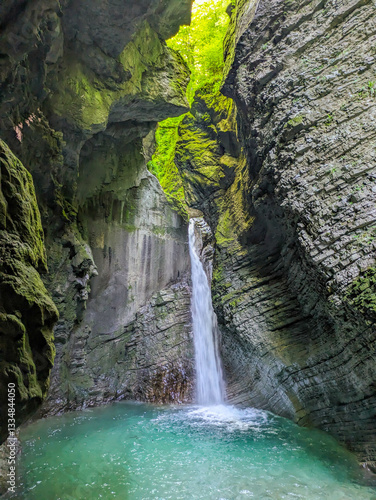 Soca Valley, Slovenia – Aerial view of the emerald-green Alpine River Soca on a bright sunny summer day with green foliage..The last wild river in Europe in Triglav National Park near the Vricic Pass
