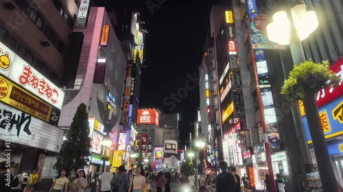 Shinjuku, Tokyo, Japan - August 15 2024: Kabukicho street at night. The iconic red neon Kabukicho gate sign