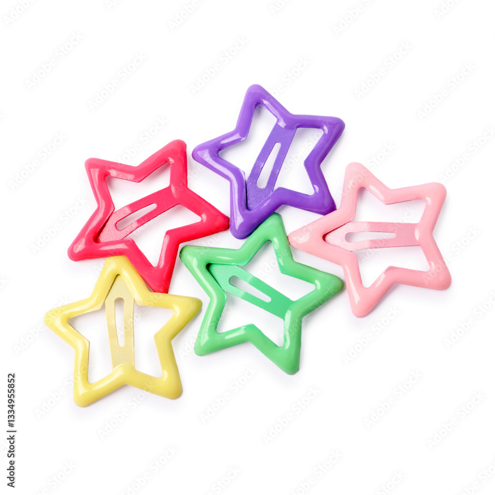 Many colorful star shaped hair clips isolated on white, top view Many colorful star shaped hair clips isolated on white, top view