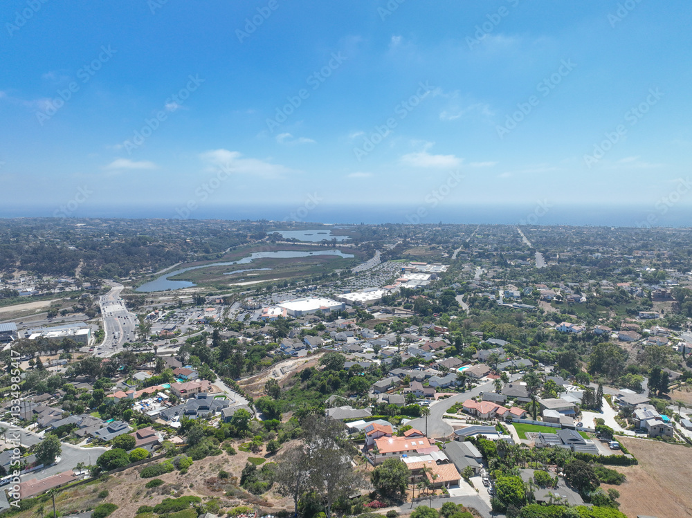 Aerial view of middle class houses in the valley of Oceanside town in San Diego, California. USA.