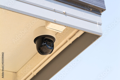 Surveillance installation on building edge urban setting technology outdoor close-up view