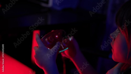 A preschool-age girl plays games using a joystick