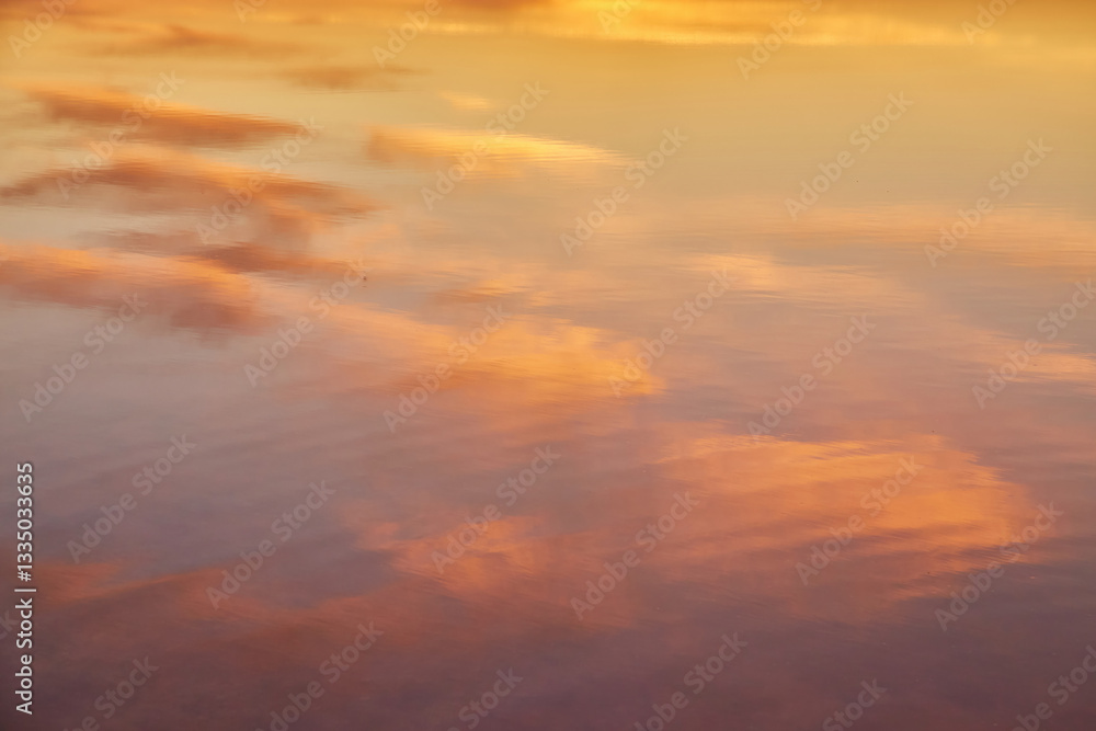 Obraz premium Golden Clouds Reflected in Water