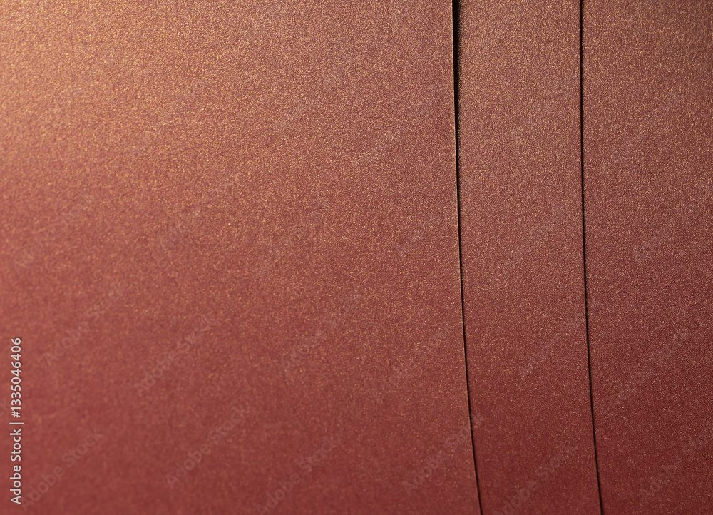 Fototapeta premium Rich burgundy paper texture with a pearlescent shimmer and glossy finish. Elegant and metallic reflective surface, perfect for luxury design and premium decorative backgrounds..