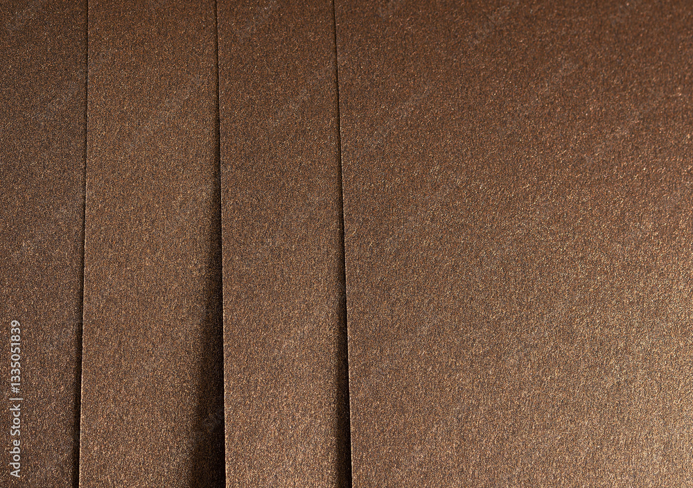 Fototapeta premium Elegant brown paper texture with a subtle grainy surface and shimmering effect. Premium monochrome material, perfect for luxury stationery, artistic backdrops, and decorative designs..
