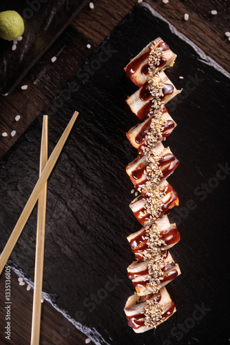 Appetizing sushi served with wasabi on a dark background in elegant restaurant style. Perfect for menu design, Japanese cuisine, gourmet dining, and food photography.