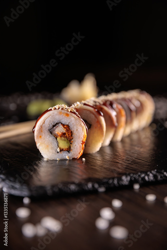 Appetizing sushi served with wasabi on a dark background in elegant restaurant style. Perfect for menu design, Japanese cuisine, gourmet dining, and food photography.