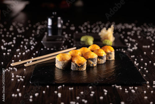 Appetizing sushi served with wasabi on a dark background in elegant restaurant style. Perfect for menu design, Japanese cuisine, gourmet dining, and food photography.