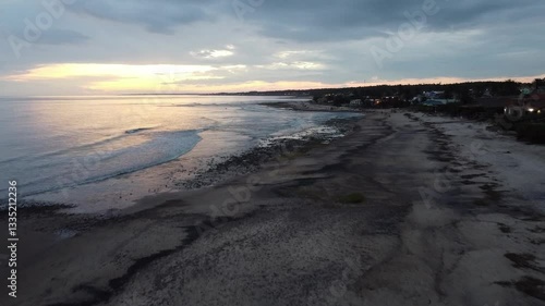 Wallpaper Mural Piriápolis beach sunset with tranquil shoreline and darkening skies Torontodigital.ca