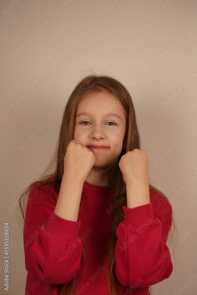 Her intense gaze reflects her inner strength. A powerful moment capturing youthful determination. With fists raised confidently, the young girl conveys a sense of defense and resolve. Her intense gaze reflects her inner strength. A powerful moment capturing youthful determination. With fists raised confidently, the young girl conveys a sense of defense and resolve.