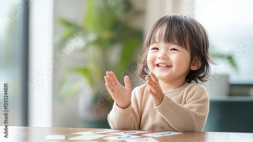 Children Learning Math Through Interactive Play, joyful child clapping while learning with cards