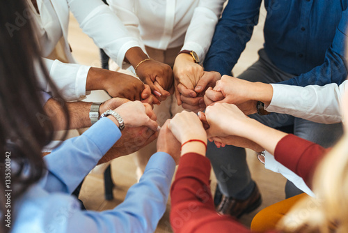 Canvas Print Diverse Group Displaying Unity Through Joined Hands in a Team Gesture