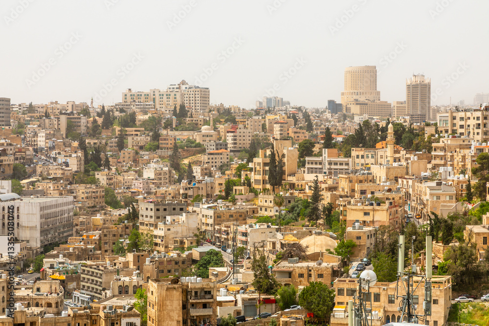 Lots of residential houses densily scattered on the hills in the downtown of Amman city, Kingdom of Jordan Lots of residential houses densily scattered on the hills in the downtown of Amman city, Kingdom of Jordan