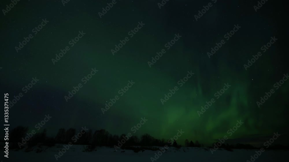 Green and red aurora borealis crossing the starry night sky over snowy mountains and forest in lapland finland and sweden. 4K resolution footage time lapse. Green and red aurora borealis crossing the starry night sky over snowy mountains and forest in lapland finland and sweden. 4K resolution footage time lapse.
