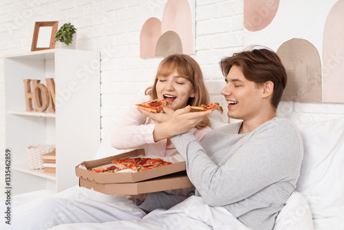 Beautiful young couple feed...