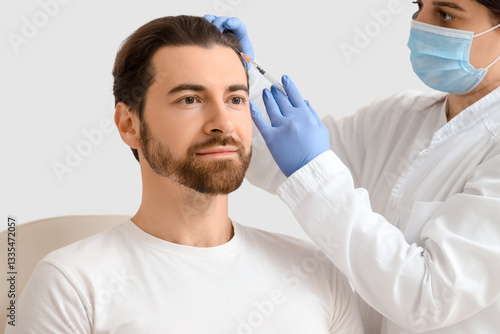 Female trichologist giving ...