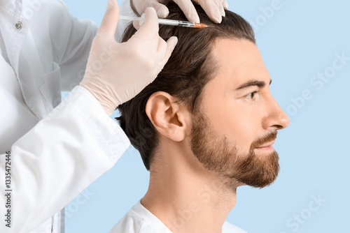 Young man receiving injecti...