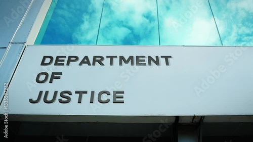 Department of Justice sign on a modern building with glass windows, symbolizing law, justice, and government authority