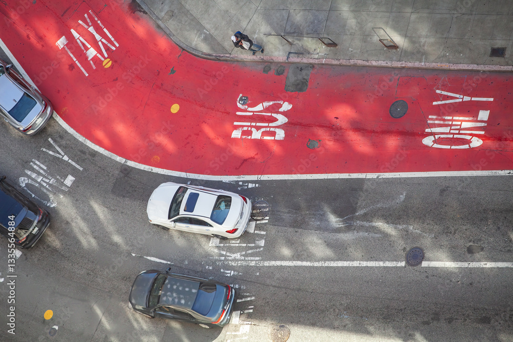 Aerial view of a city intersection with designated taxi and bus lanes