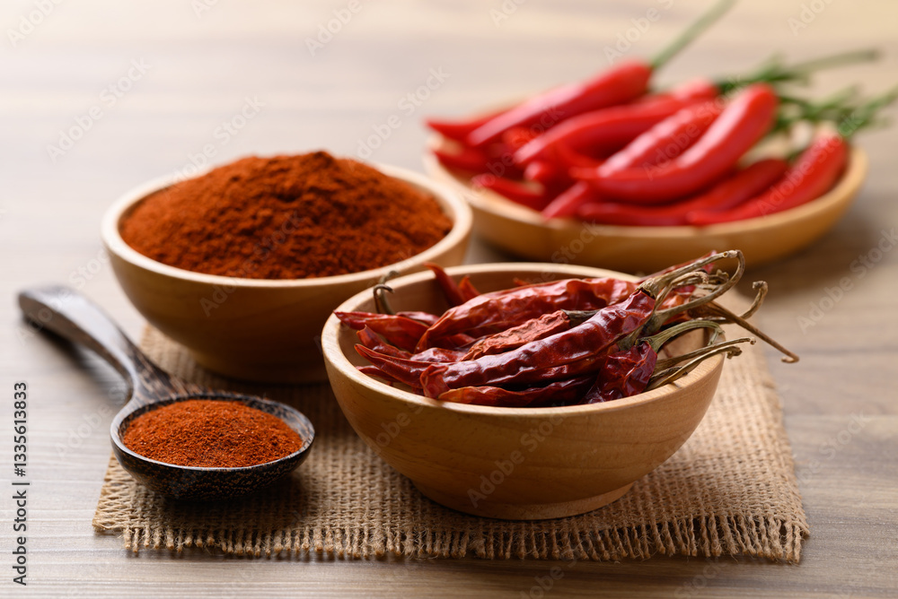 Dried chili peppers and chili powder on wooden background, Food ingredient Dried chili peppers and chili powder on wooden background, Food ingredient