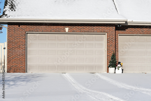 Tire Tracks in the Snow on the Driveway