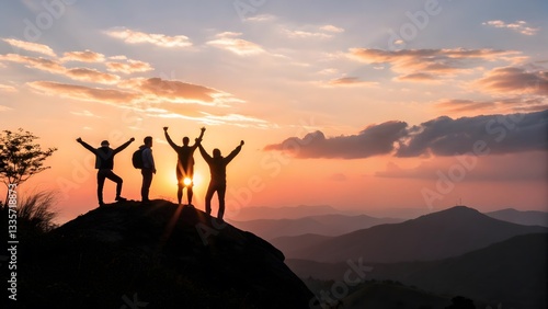 Friends Celebrating Success at Sunset on a Mountain Top
