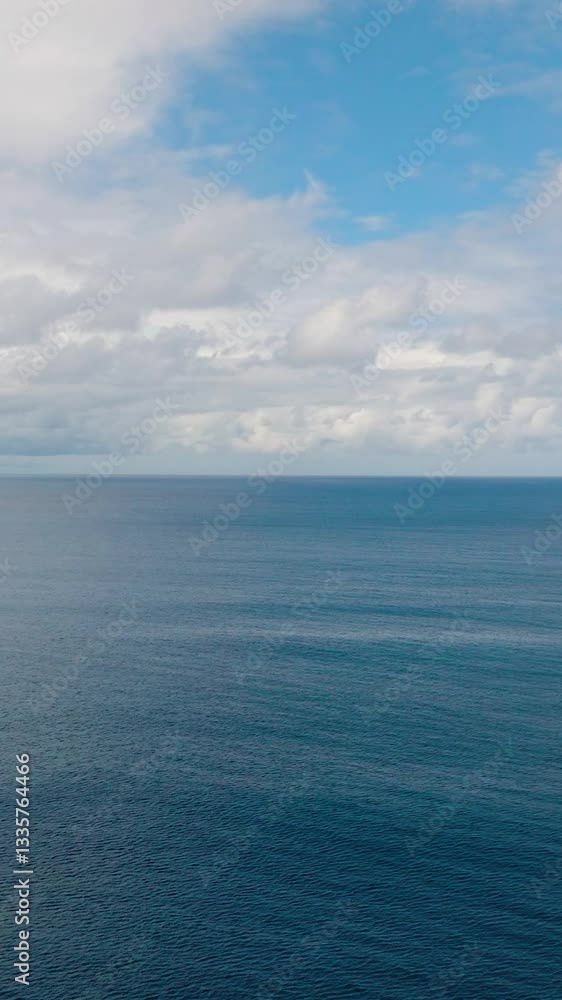 Expansive ocean view with a mix of blue water and white clouds, showing the clear horizon. Seychelles, Mahe. Expansive ocean view with a mix of blue water and white clouds, showing the clear horizon. Seychelles, Mahe.