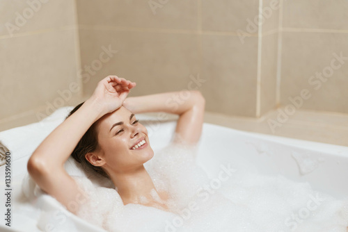 Relaxed woman enjoying a bubble bath, smiling blissfully and soaking in the soothing warmth of the water. Self-care and wellness concept for tranquility and relaxation.