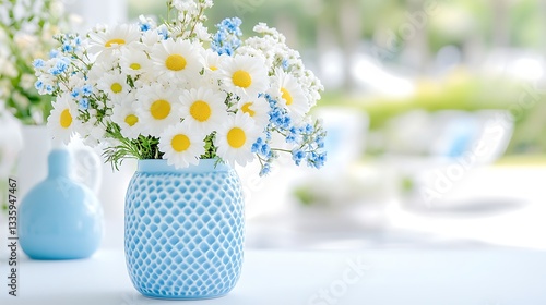 Fresh floral arrangement in blue vase indoor space still life bright setting close-up