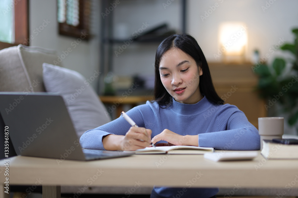 Serious young Asian woman is bored from working at home. Serious young Asian woman is bored from working at home.