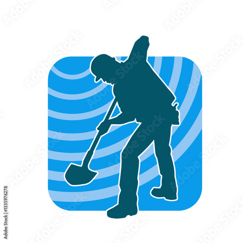 Silhouette of a worker carrying shovel tool. Silhouette of a worker in action pose using shovel tool.