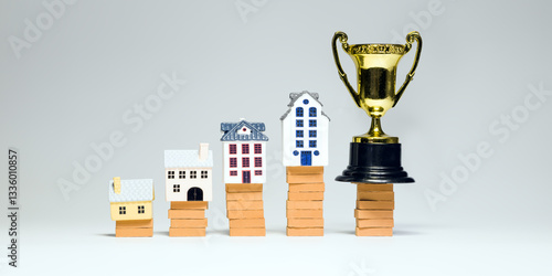 Obraz na płótnie Miniature houses stacked on bricks with a trophy symbolize growth in real estate investments, increased property value and financial success. w salonie