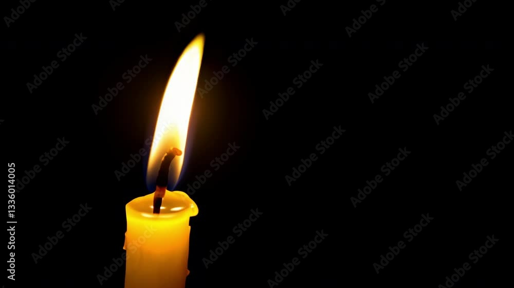 A solitary candle flickers, casting a warm glow in the darkness. A solitary candle flickers, casting a warm glow in the darkness.