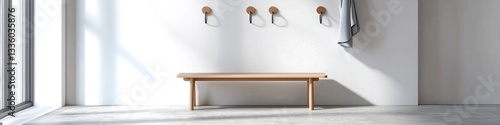 Obraz na płótnie Minimalist entryway with a simple bench and wall hooks. w salonie