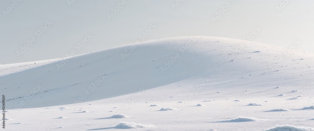 A white snow covered hill with a few small snow patches A white snow covered hill with a few small snow patches