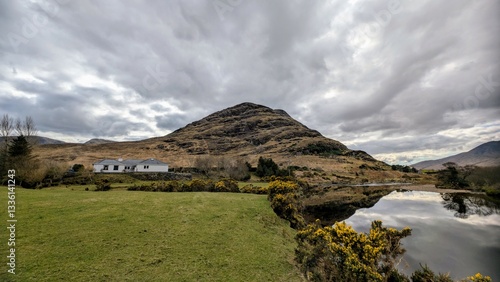 Obraz na płótnie Beautiful landscape scenery, farmhouse by river Erriff surrounded by mountains near Aesleagh falls, county Mayo, Ireland, nature background w salonie
