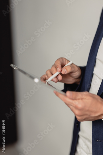 businessman holding a tablet