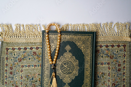 Quran with Beads on a Prayer Mat